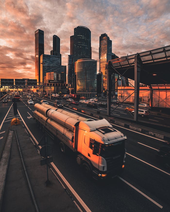 A stunning vertical shot of Moscow's skyline at sunset with traffic below, highlighting urban life and architecture.
